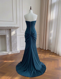 Elegant Midnight Blue Ruched Strapless Evening Gown with Snowflake Crystal Brooch